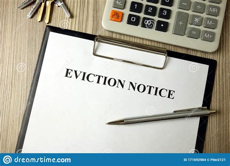 Home Eviction Notice Legal Document With Pen Calculator And Keys Stock