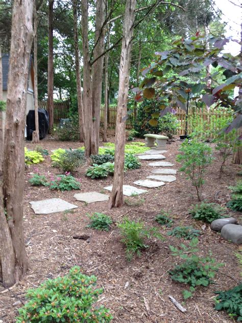 Irregular Flagstone Walkway Set In A Stonedust Base Leads Through This