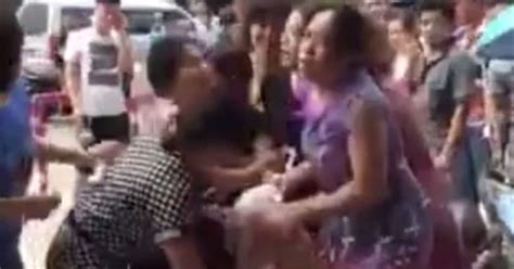 Mob Of Angry Wives Strip Mistress In Street After She Was Caught Red Handed With One Of