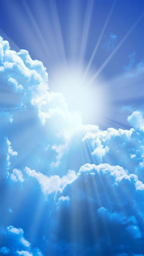 The Sun Shines Brightly Through The Clouds In This Blue And White Sky
