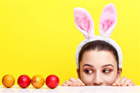 Premium Photo Happy Young Woman Wearing Bunny Ears And Having Easter Eggs