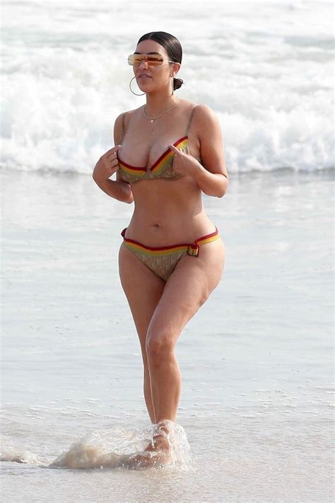Kim Kardashian Looks Bootylicious In Barely There Bikini While Sister