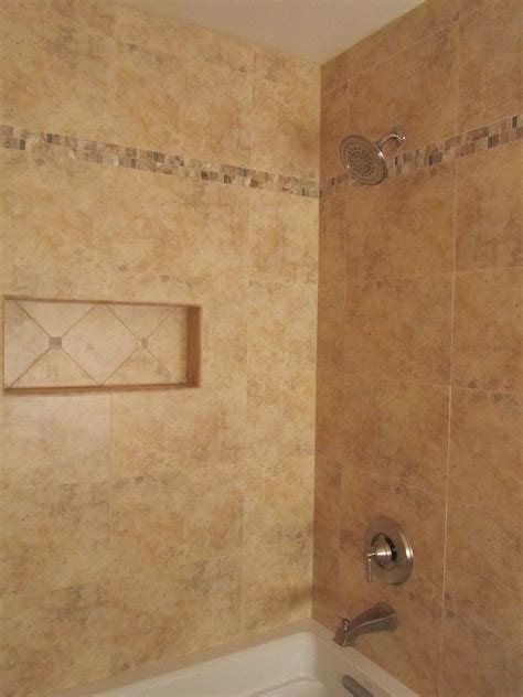Just look to this bathroom designed by zoe feldman. Bathtub tile | Bathtub tile, Earth tones bathroom, Tile ...