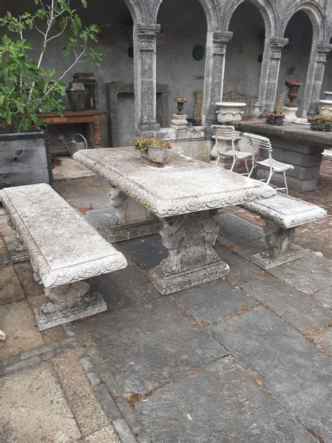 We sell a wide range of stone benches, seats, tables & chairs made from granite or cast stone. Stone garden table with 2 benches - Piet Jonker