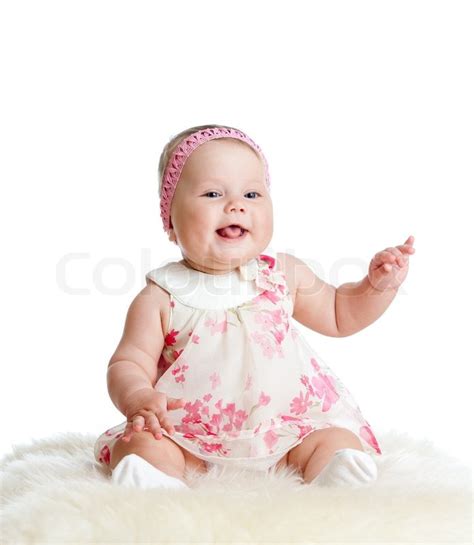 Cute Baby Girl Sitting And Smiling Stock Photo Colourbox