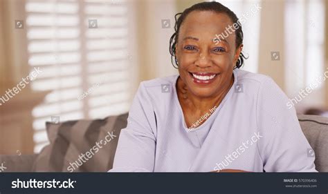 older black woman happily looks camera 스톡 사진 570396406 shutterstock