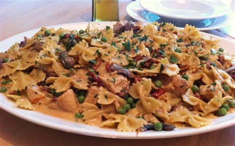 It took a few tries but is now perfected. Chicken and Farfalle Pasta in a Roasted Garlic Cream Sauce ...