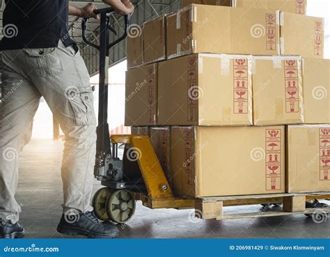 Shipment Boxes Warehousing Worker Working With Hand Pallet Truck Unloading Cargo Boxes On