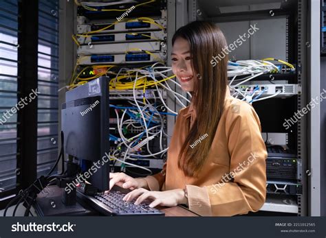 Technician Performing Maintenance Tasks Server Room Stock Photo