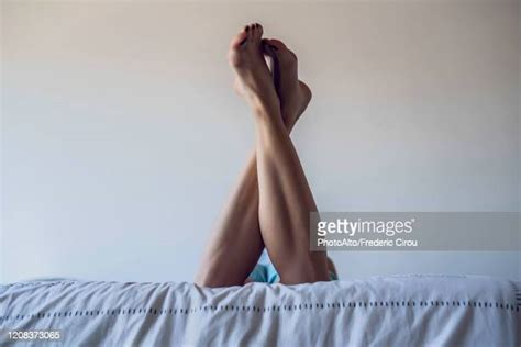 Woman Lying On Stomach With Feet Up Bildbanksfoton Och Bilder Getty
