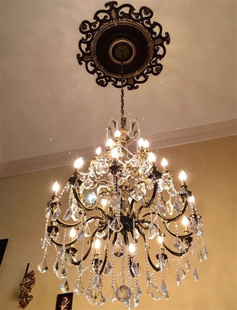 Creating a frame around the light's canopy. Ekena Millwork Orleans Ceiling Medallion with Light ...