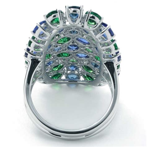 One of the most popular choices of gemstone, sapphires have been long associated with tradition, royalty and wisdom. Green Tanzanite, Blue Sapphire, & Diamond Cluster Ring | New York Jewelers Chicago