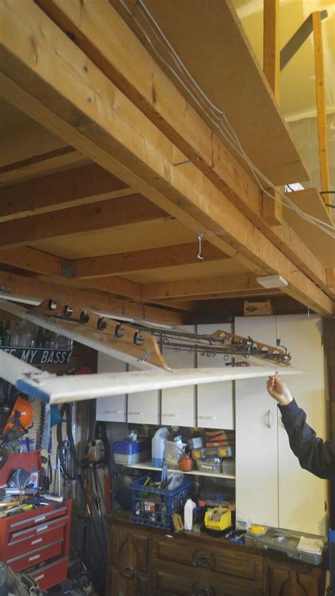 That is a whole lot more fishing pole storage than i am needing haha that is pretty cool though. Fishing rod storage in garage ceiling | Fishing rod storage, Diy fishing rod holder, Fishing ...
