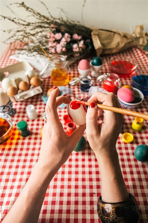 Woman Colouring Easter Eggs By Stocksy Contributor Marija Savic