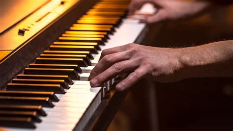 Premium Photo Male Hands On The Piano Keys