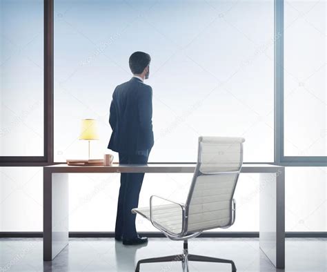 Businessman Standing In Office — Stock Photo © Kantver 52520497