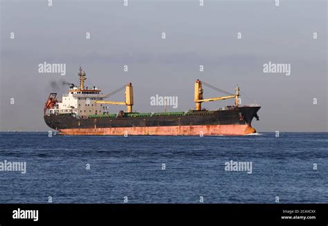 A Cargo Ship Carrying Goods Between Ports Stock Photo Alamy