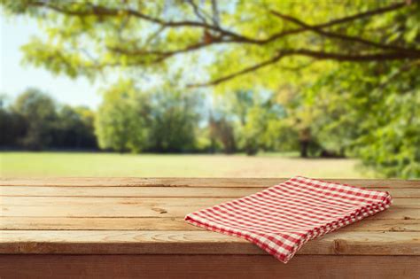 Spring twigs on shabby background, frame, flat lay. Empty Wooden Table With Tablecloth Over Autumn Nature Park ...