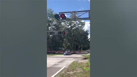 Amtrak Train Passes By Railroad Crossing Youtube