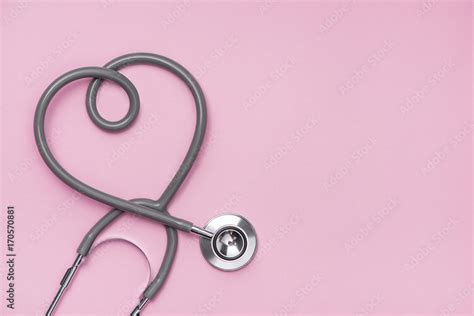 Medical Concept The Stethoscope With Heart Shape On Pink Background