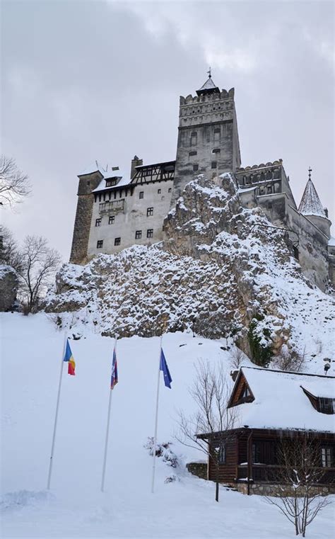 The Snow Covered Medieval Castle Of Bran Known For The Castle Of