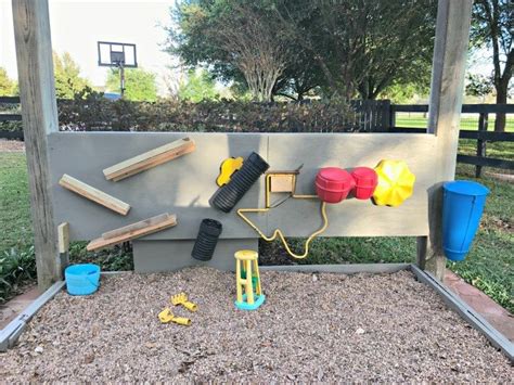 A Fun Pea Gravel Play Area And Backyard Activity Wall Abbotts At Home