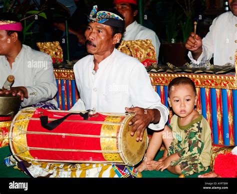 Balinese Gamelan Musician Playing Drum During A Traditional Balinese