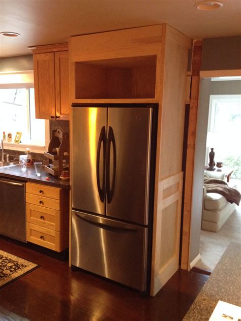 This compact cabinet features a sliding barn style door and will house your microwave and a mini fridge. Refrigerator enclosure | Kitchen renovation, Kitchen built ...
