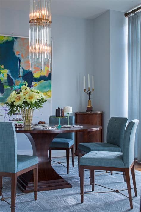 Contemporary Blue Dining Room With Wood Table And Upholstered Blue