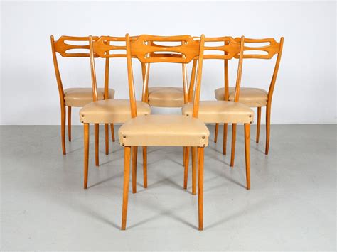 Aadvik dining chairs are sold in sets of two and are perfect as dining chairs, accent chairs, or desk chairs. Italian Dining Chairs in Polished Maple Wood, Set of 6 for sale at Pamono