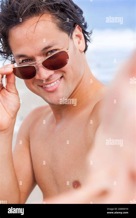 Attractive Handsome Biracial Asian Male Man On Beach Vacation Wearing