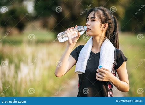Women Stand To Drink Water After Exercise Stock Photo Image Of Summer