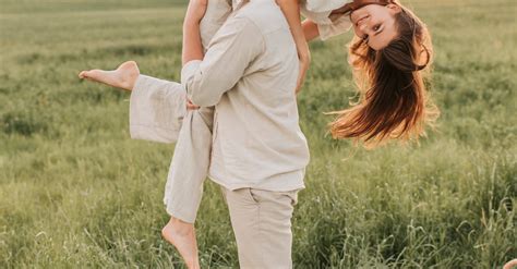 Man Carrying Woman In The Middle Of A Grass Field · Free Stock Photo