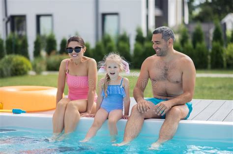 Cheerful Daughter Feeling Excited Before Swimming In Pool Stock Image