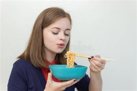Young Caucasian Girl Woman Eating Instant Noodles Ramen With Chopsticks