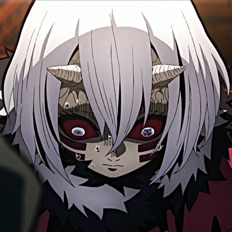 An Anime Character With Long White Hair And Horns On His Head Wearing