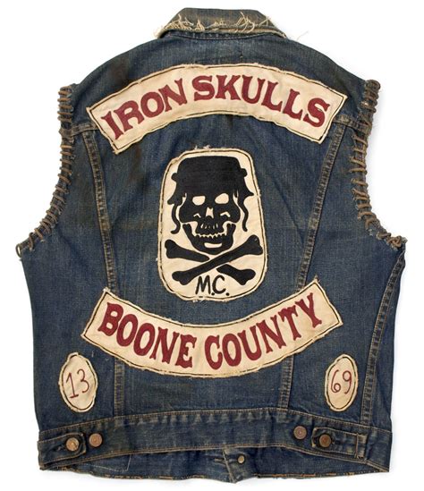 An Iron Skull Denim Vest With Bones On It