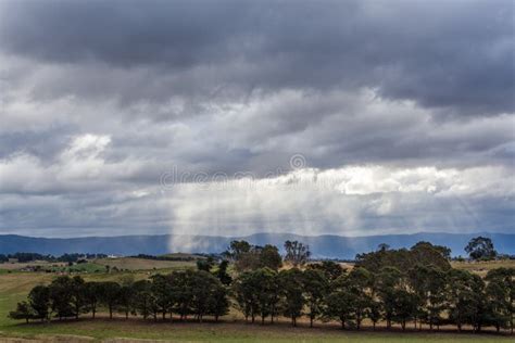 Australian Countryside Landscape Sun Rays Protruding Through Storm