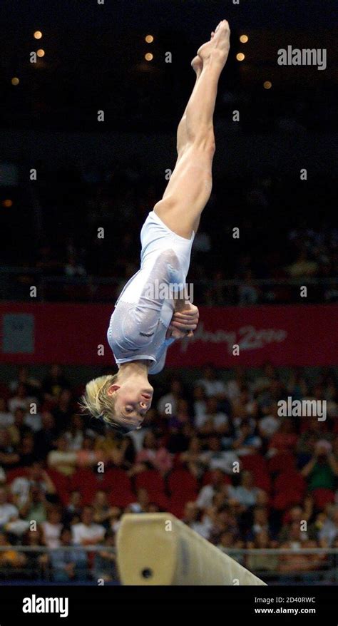 Russias Svetlana Khorkina Dismounts From The Beam During The Womens Qualification For The