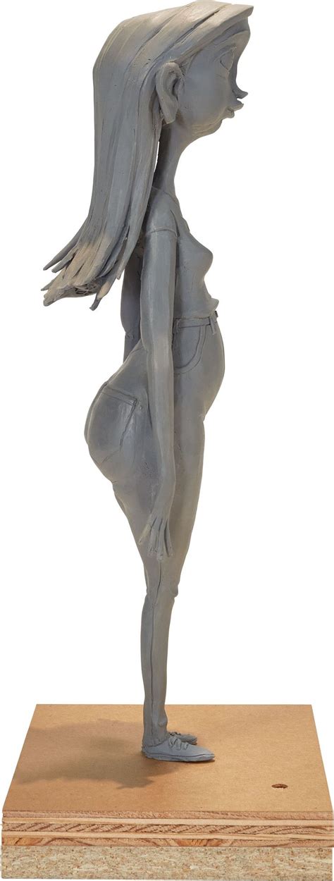 A Statue Of A Woman Standing On One Leg