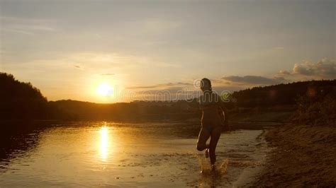 teenage girl runs along beach at sunset stock image image of sunset motion 103217343