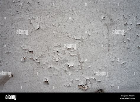 Cracking Paint On A White Wall Surface Background Stock Photo Alamy