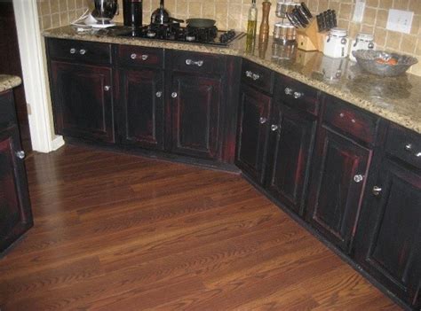 The attraction of creating distressed black kitchen cabinets is that it's an easy way to give a rustic look to your kitchen. Distressed Black Kitchen Cabinets Inspiration | Home Interiors