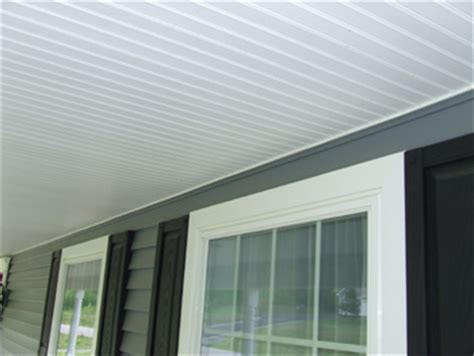I started putting up vinyl soffit all around my house and that has gone so well that we decided to do the front porch ceiling and under the carport the same way. Using Vinyl Beadboard Soffit for Porch Ceilings