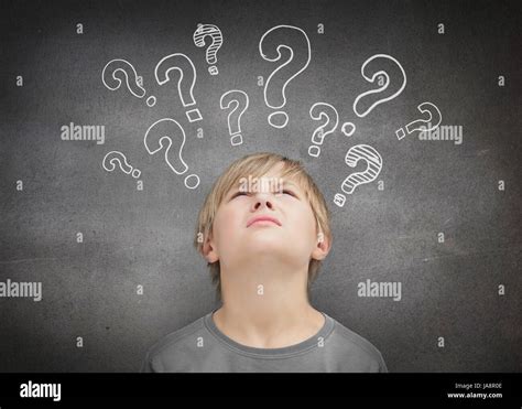 Thinking Child Looking At Question Marks Above His Head Stock Photo Alamy