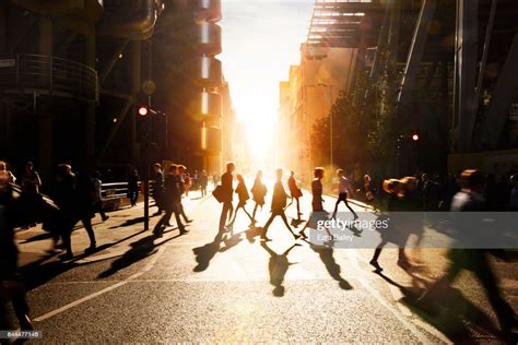 Business People Walking Through At City At Dawn Bildbanksbilder Getty