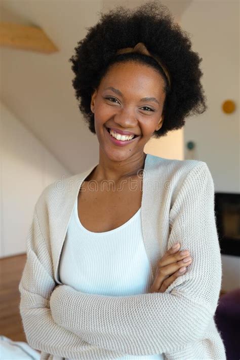 Portrait Of Cheerful Young African American Afro Woman At Home Copy