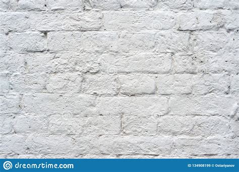 Brick Wall Painted With White Paint With Drawing The