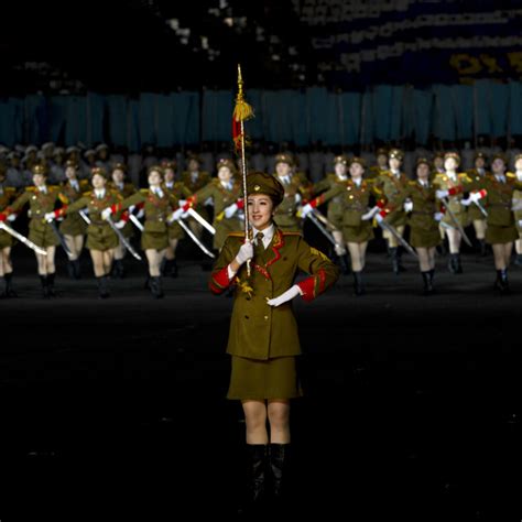 Sexy North Korean Women Dressed As Soldiers Dancing With Swords During The License