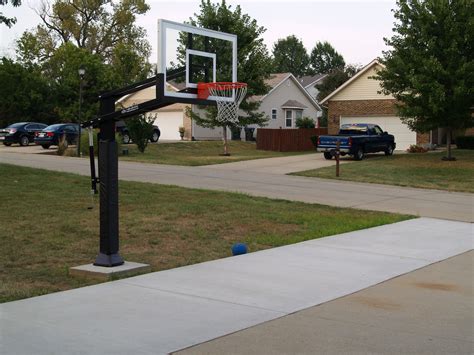 Pro Dunk Gold Basketball System Is Installed Behind The Driveway On The